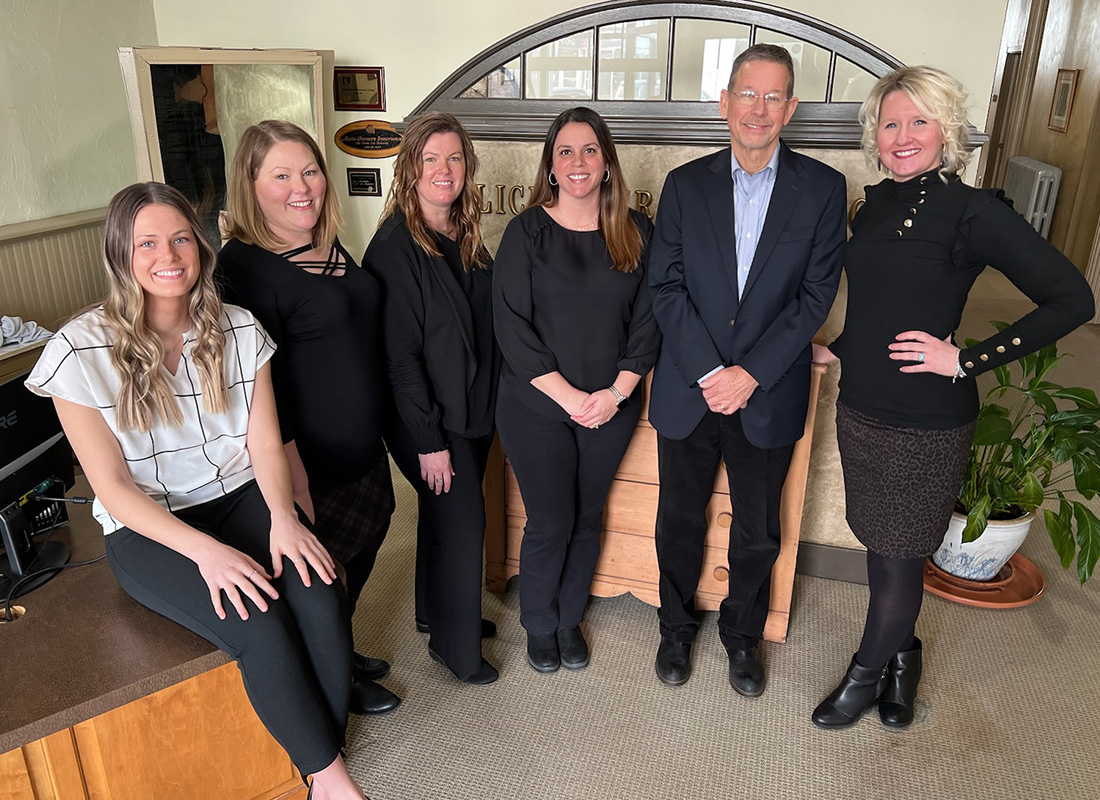 About Our Agency - Flickinger Insurance Team Standing Together Inside Their Office